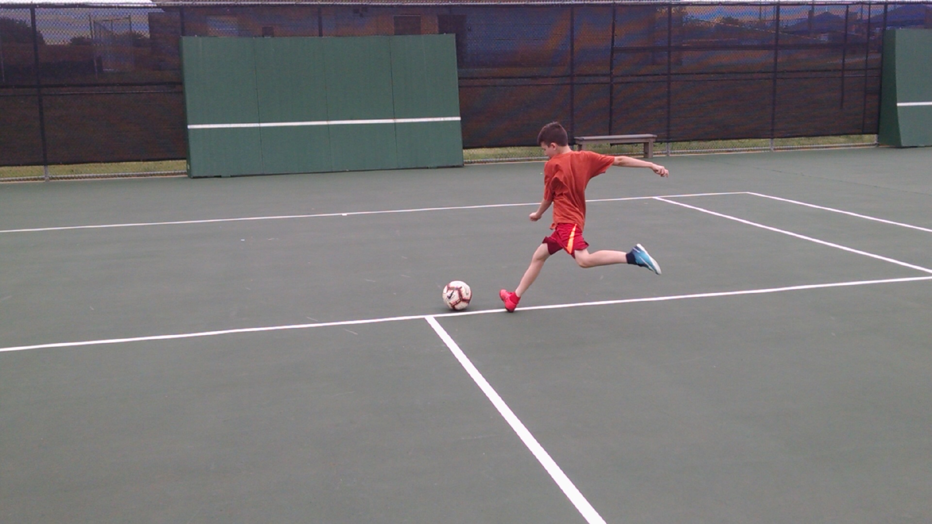 using a wall soccer training shooting ball